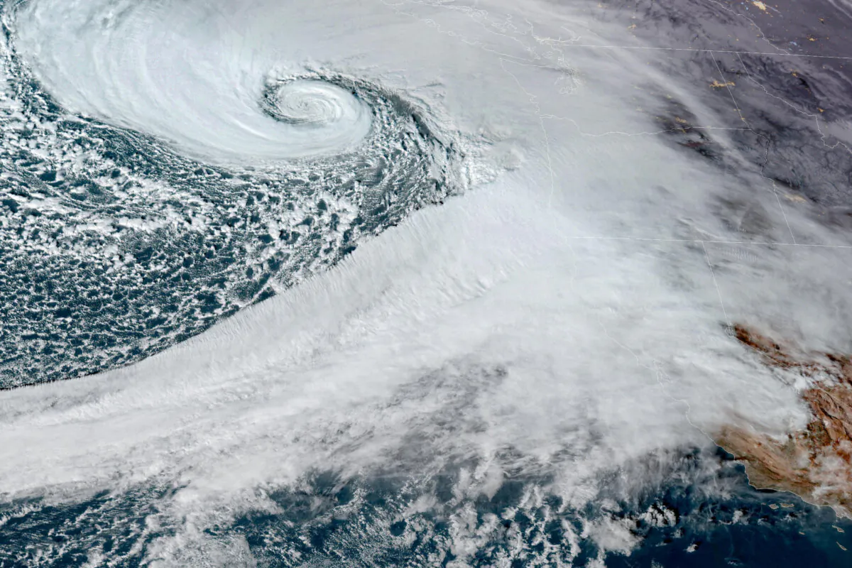 A low pressure storm system known as a "bomb cyclone" forms off the coast of the U.S. Pacific Northwest and western Canada in a composite satellite image on Nov. 19, 2024.  (CIRA/NOAA/Handout via Reuters)