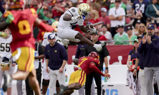 No. 5 Notre Dame Punches CFP Ticket With 2 Late Interception Return TDs to Beat USC 49–35
