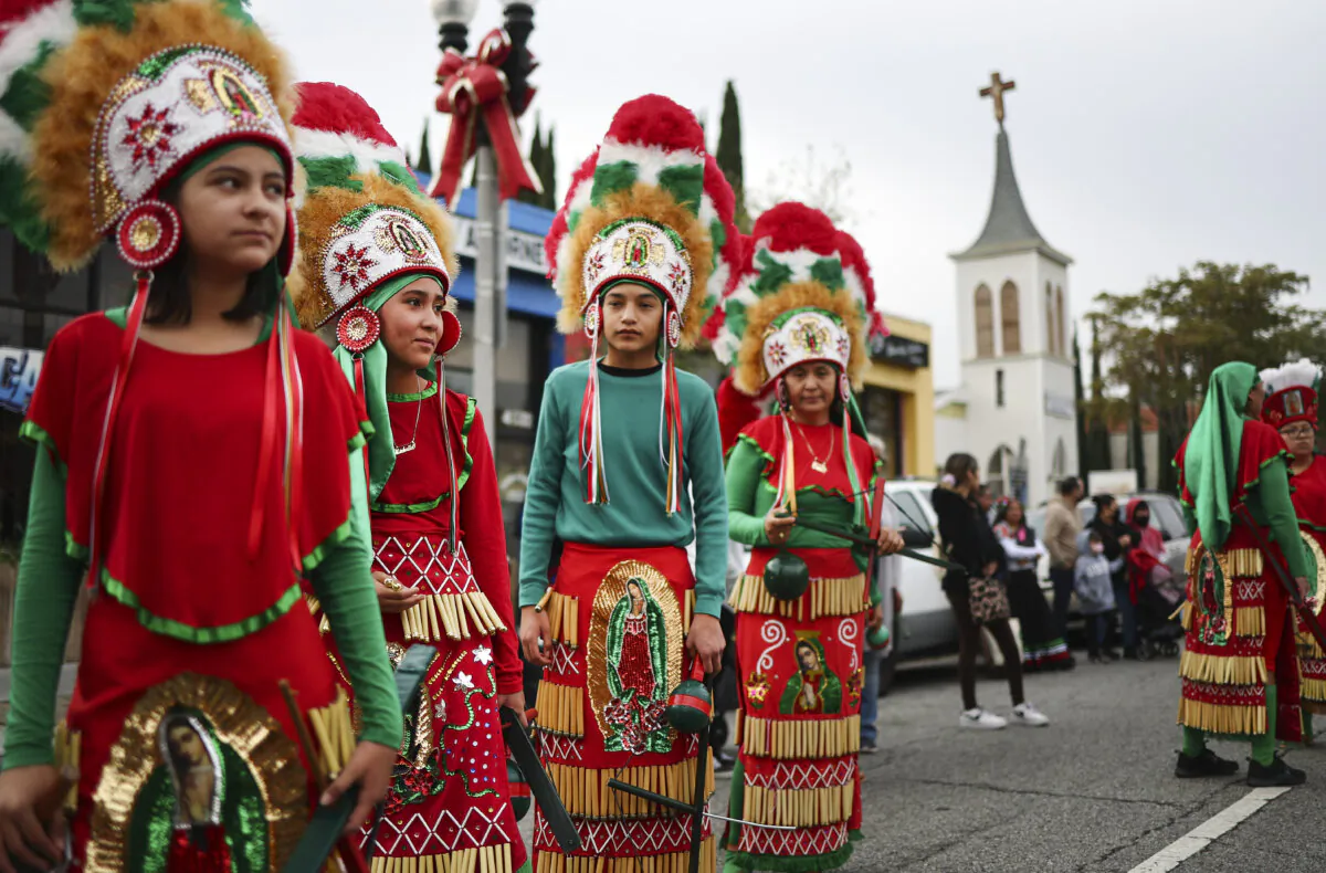 Participants wait to march in the 91st Procession and Mass honoring Our Lady of Guadalupe and St. Juan Diego, in the traditionally Latino community of East Los Angeles, in Los Angeles on Dec. 4, 2022. (Mario Tama/Getty Images)