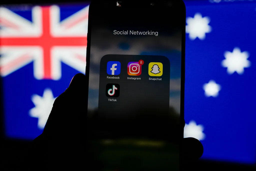 In this photo illustration, social media networking apps are displayed on a phone screen with the Australian flag displayed in the background in Melbourne, Australia on Nov. 30, 2024. (Asanka Ratnayake/Getty Images)