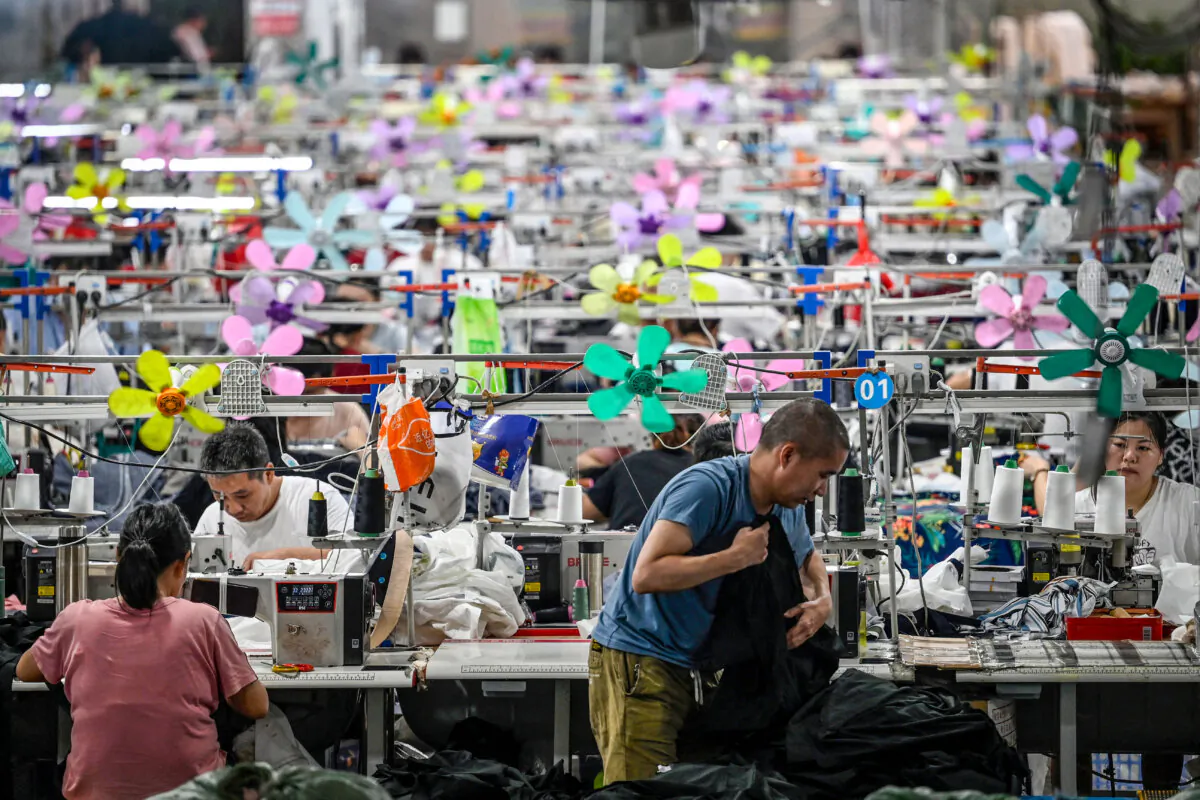 Workers produce garments at a textile factory that supplies clothes to fast fashion e-commerce company Shein in Guangzhou, China, on June 11, 2024. (Jade Gao/AFP via Getty Images)
