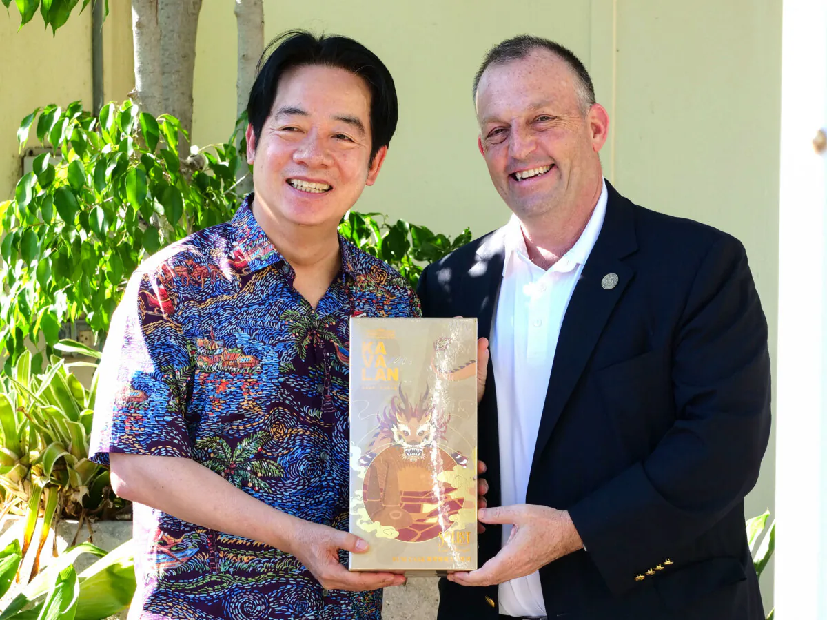 Taiwanese President Lai Ching-te presents a gift to Hawaii Gov. Josh Green at the Hawaii Emergency Management Agency in Honolulu on Nov. 30, 2024. (Ronen Zilberman/AFP via Getty Images)