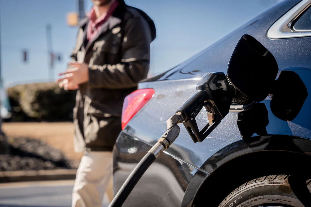 A person puts gas in his car at a gas station in Greenville, S.C., on Feb. 3, 2024. (Madalina Vasiliu/The Epoch Times)