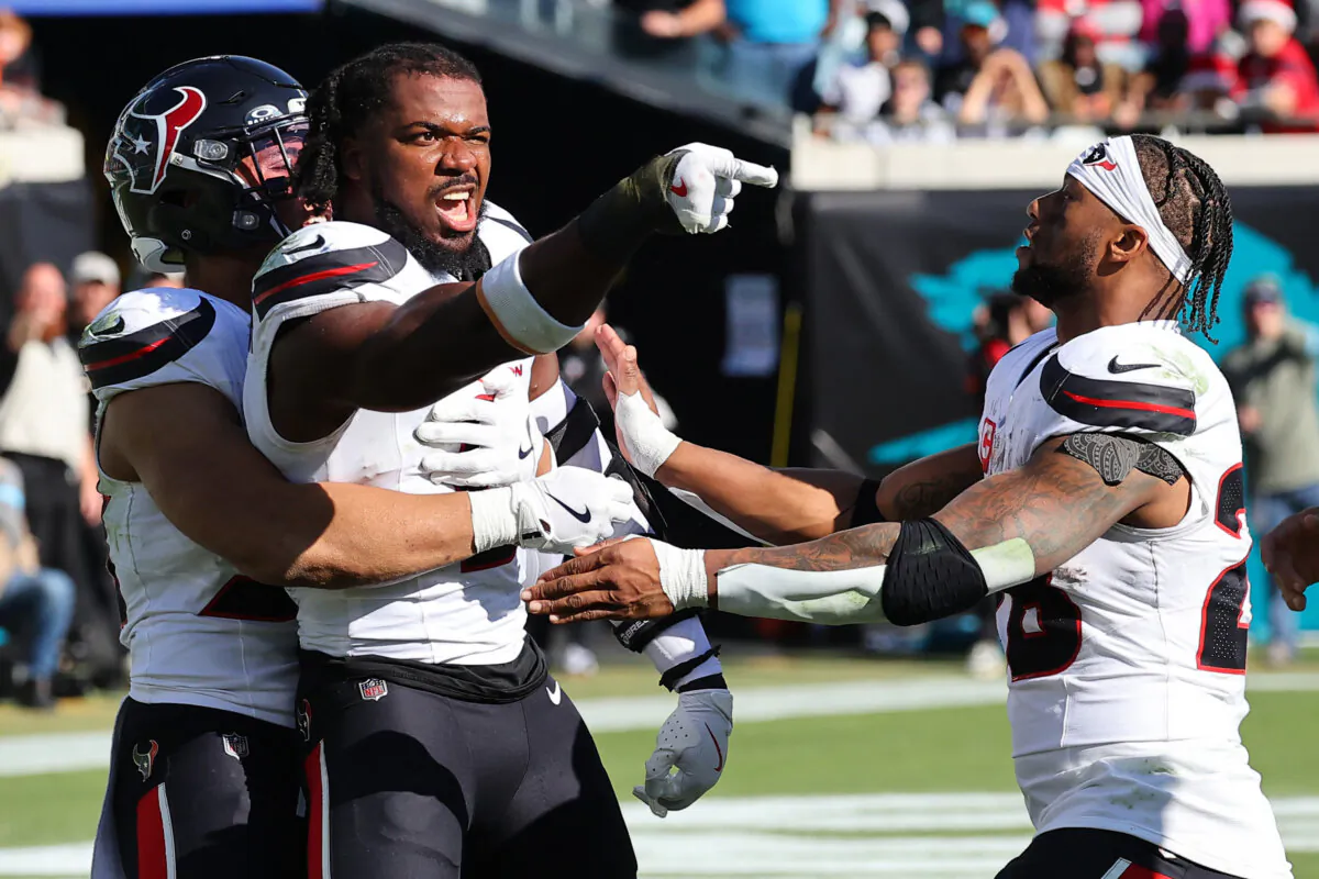 Azeez Al-Shaair of the Houston Texans points to the Jacksonville Jaguars' bench after being ejected in the second quarter of a game at EverBank Stadium in Jacksonville, Fla., on Dec. 1. (Mike Carlson/Getty Images)