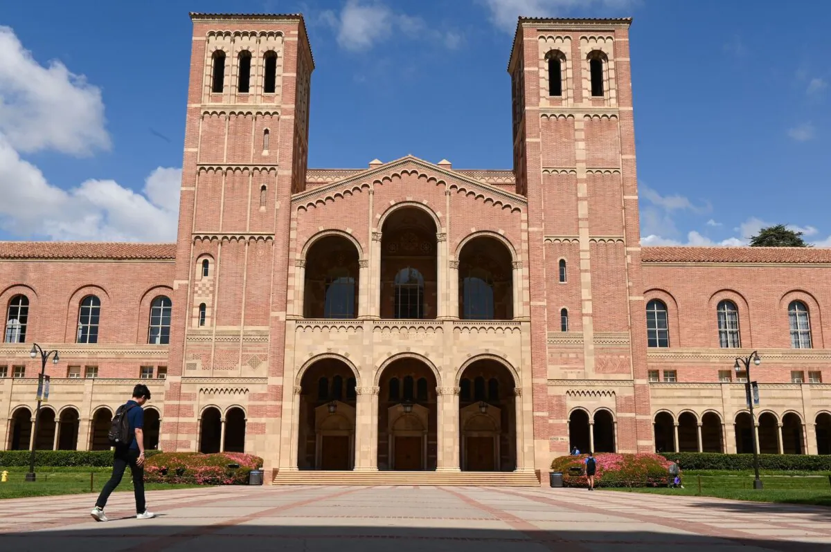 A student walks toward Royce Hall on the campus of University of California–Los Angeles (UCLA) on March 11, 2020. (Robyn Beck/AFP via Getty Images)