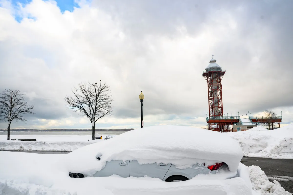 A buried vehicle along the shore of Lake Erie after a record snowfall left over 3 feet on the ground in Erie, Pa., on Dec. 2, 2024. (Jeff Swensen/Getty Images)