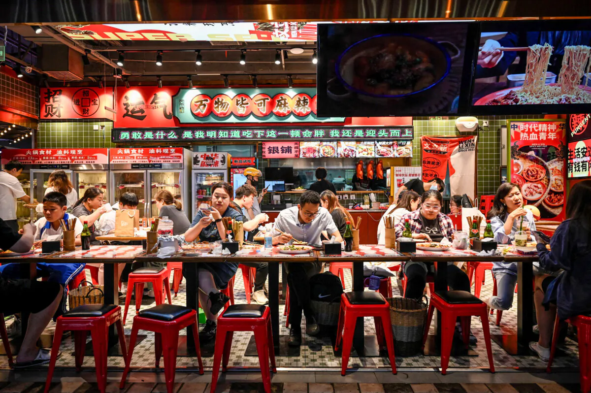 People dine at a restaurant at a shopping mall in Beijing on May 26, 2023. (Jade Gao/AFP via Getty Images)