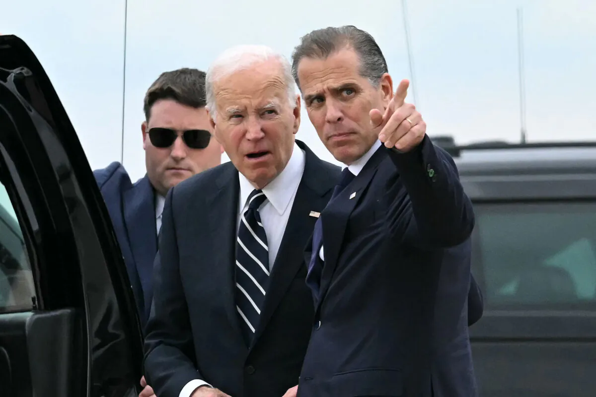 President Joe Biden talks with his son Hunter Biden upon arrival at Delaware Air National Guard Base in New Castle, Del., on June 11, 2024. (Andrew Caballero-Reynolds/AFP via Getty Images)