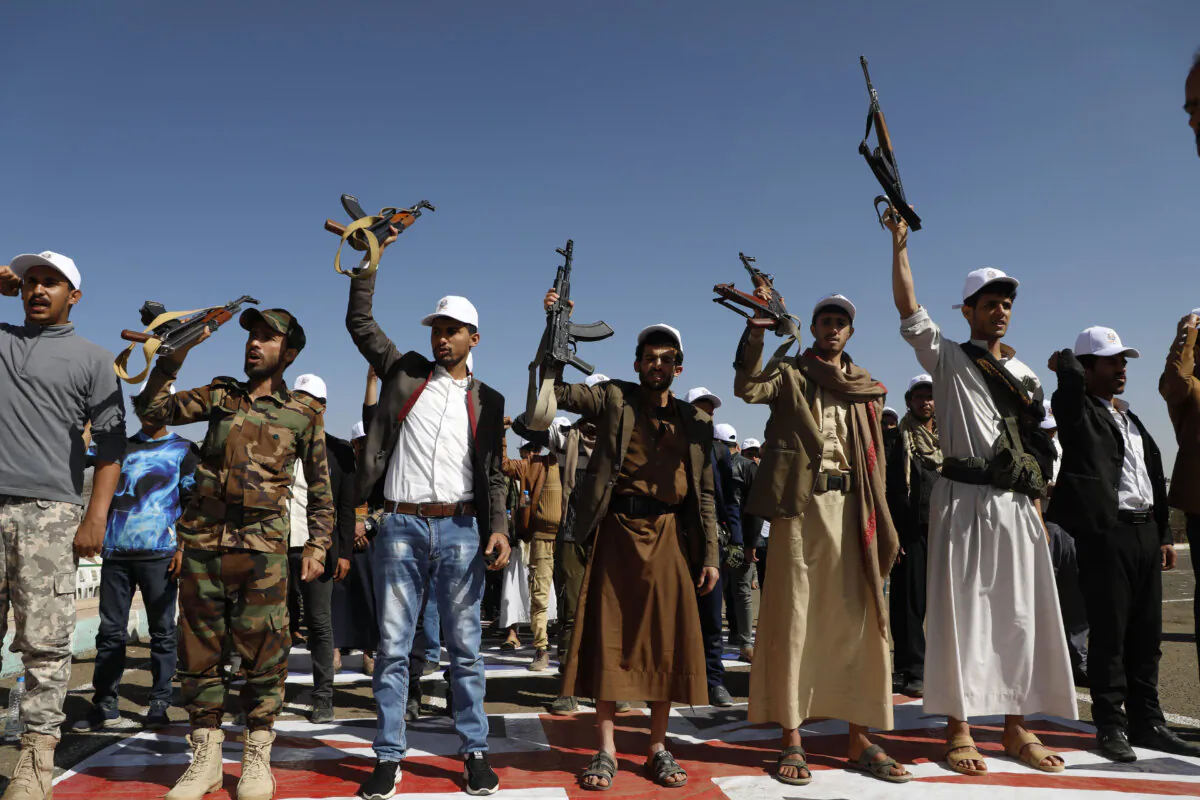 Newly recruited members of the Houthi terrorist group attend a protest march against the U.S.-led strikes on Yemen and the Israeli war in the Gaza Strip, in Sanaa, Yemen, on Feb. 21, 2024. (Osamah Abdulrahman/AP Photo)
