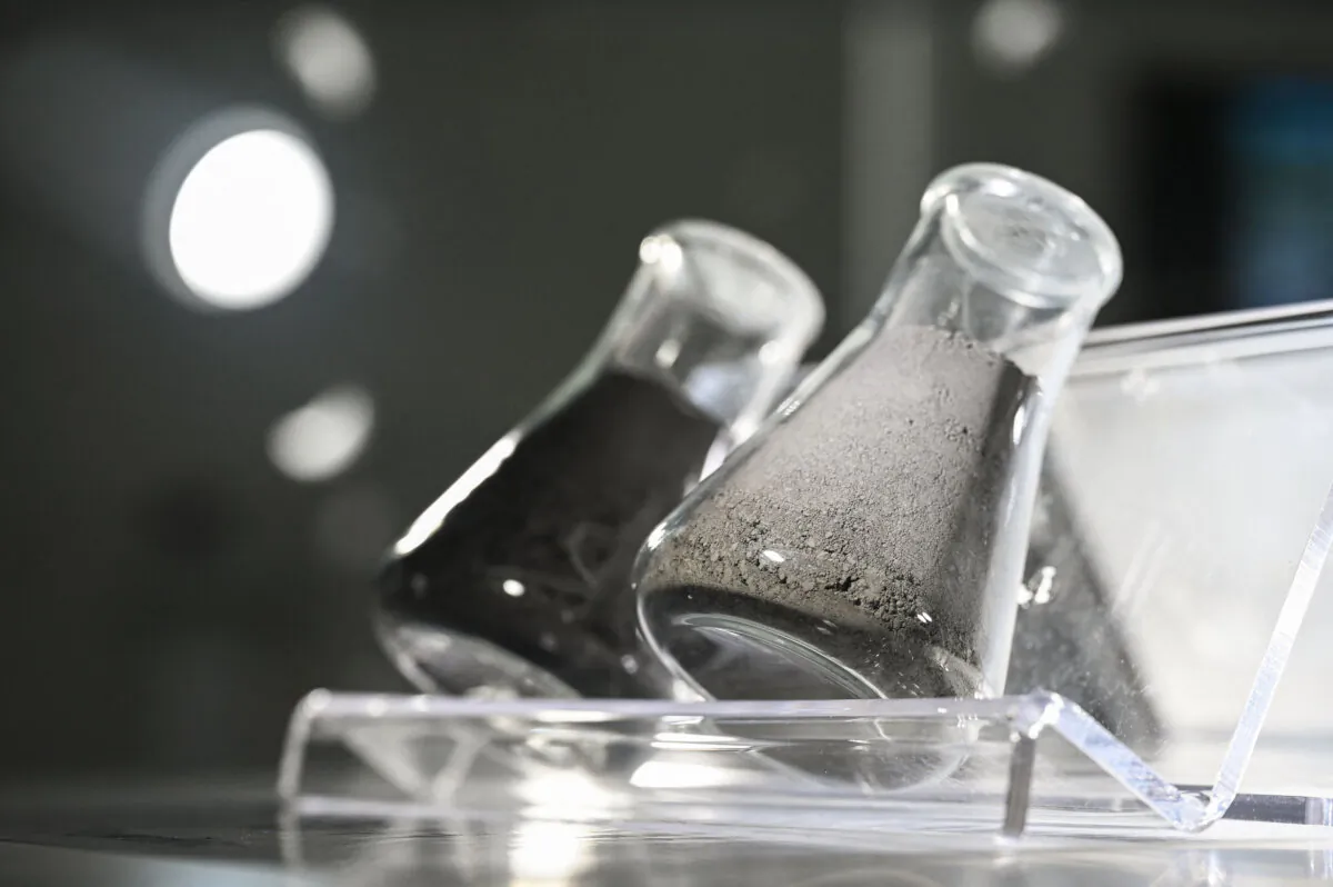 Graphite powder (L), which are used to make lithium-ion batteries, is displayed in the showroom at the Z Site production center of Chinese EV battery maker CATL (Contemporary Amperex Technology Co., Limited) in Ningde, in southeast China's Fujian Province, on Nov. 15, 2024. (Greg Baker/AFP via Getty Images)