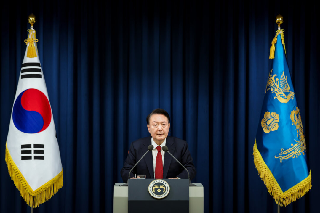Day in Photos: Martial Law, Murder Trial, and Rescue at Sea