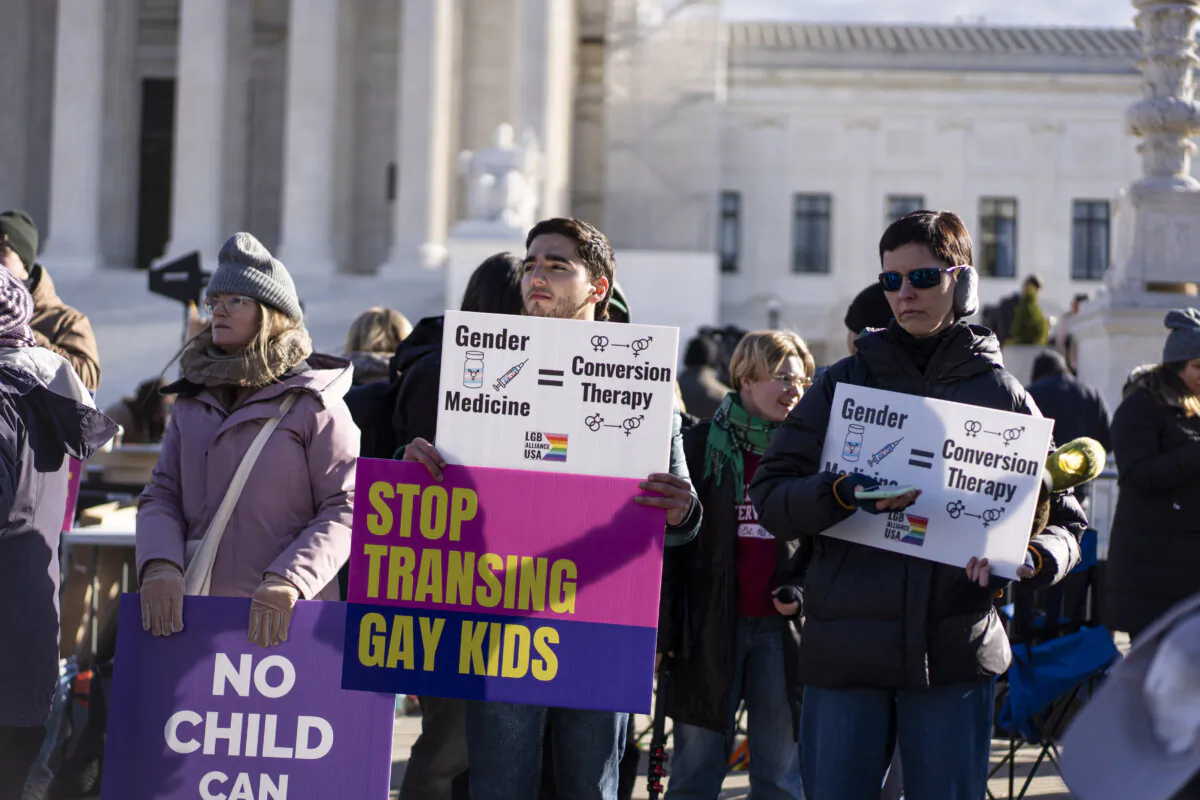 People protest as the Supreme Court hears a case over banning gender procedures for minors in Washington on Dec. 4, 2024. (Madalina Vasiliu/The Epoch Times)