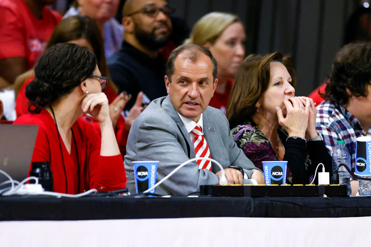 ACC Commissioner Jim Phillips (C) attends the game between the Tennessee Lady Vols and the N.C. State Wolfpack in the second round of the NCAA Women's Basketball Tournament at Reynolds Coliseum in Raleigh, N.C., on March 25, 2024 (Lance King/Getty Images)