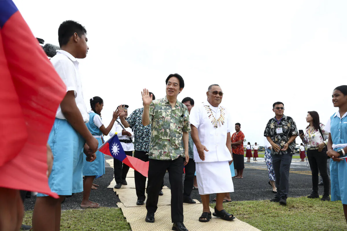 Taiwan President Lai Ching-te (center L) arrives at the Funafuti International Airport in Tuvalu on Dec. 4, 2024. Lai arrived in Tuvalu as part of a trip aimed at shoring up international support for Taiwan as China seeks to poach its few remaining allies. (Weng Rui Kun/CNA/AFP via Getty Images)