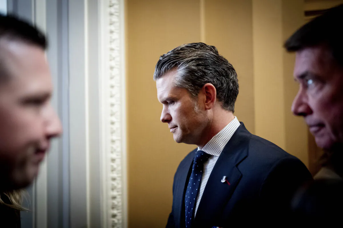 President-elect Donald Trump's nominee to be Secretary of Defense Pete Hegseth (C), accompanied by Sen. Bill Hagerty (R-Tenn.) (R), arrives for a meeting with Senate Minority Whip John Thune (R-SD) at the Capitol in Washington on Dec. 4, 2024. (Andrew Harnik/Getty Images)