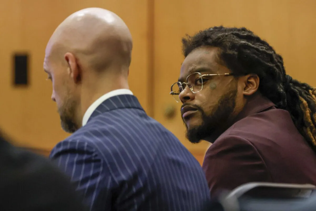 Shannon Stillwell (R) sits with his attorney Max Schardt as he looks at the prosecutors during the Young Thug trial at Fulton County Courthouse in Atlanta on Nov. 26, 2024. (Miguel Martinez/Atlanta Journal-Constitution via AP)