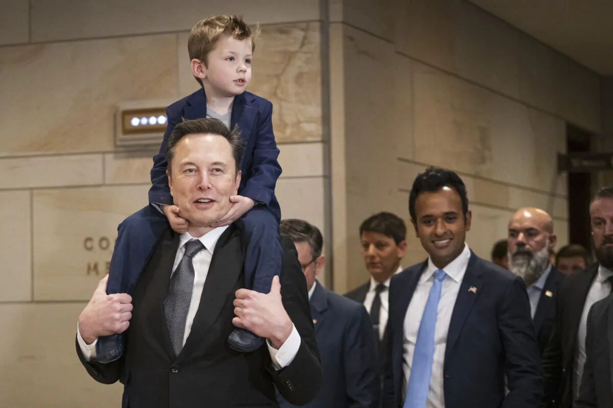 Elon Musk, CEO and Chief Engineer of SpaceX, and biotech entrepreneur Vivek Ramaswamy arrive ahead of a meeting with House Speaker Mike Johnson in Congress in Washington on Dec. 5, 2024.(Madalina Vasiliu/The Epoch Times)