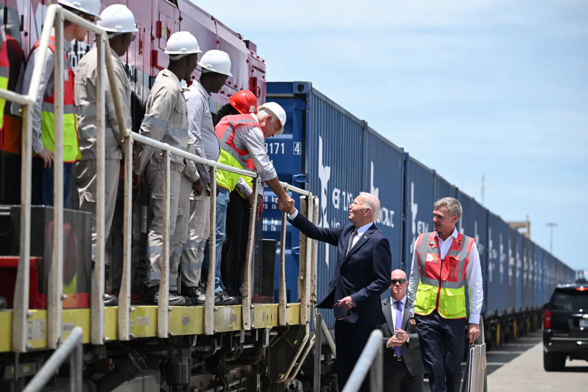 U.S. President Joe Biden meets employees of Lobito Atlantic Railway (LAR) with Director of Operations at LAR Nicolas Gregoir (R) in Lobito, Angola, on Dec. 4, 2024. (Andrew Caballero-Reynolds/AFP via Getty Images)