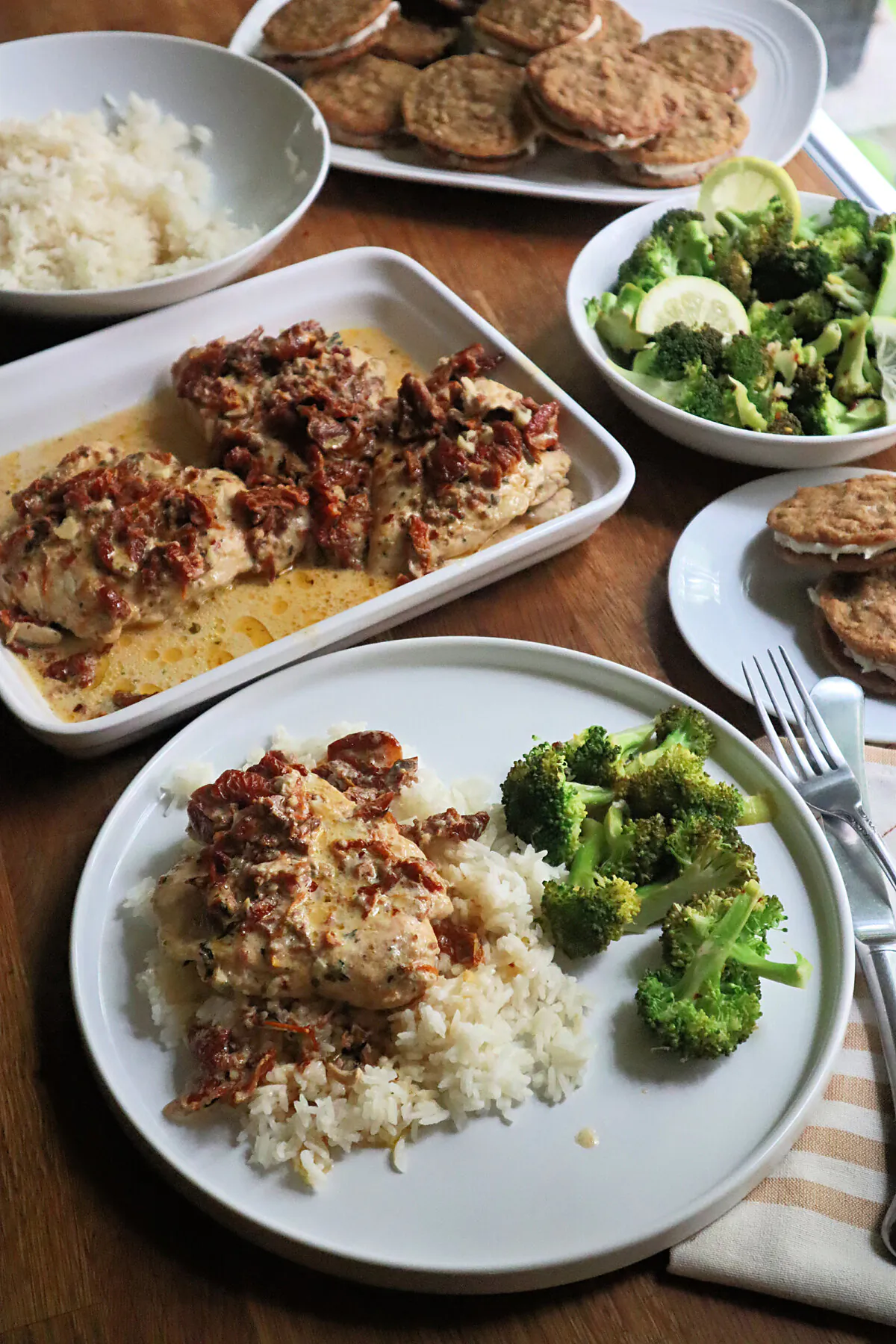 This budget dinner for four includes creamy Marry Me chicken over rice, broccoli with lemon and red pepper, and homemade oatmeal sandwich cookies for dessert. (Gretchen McKay/Pittsburgh Post-Gazette/TNS)