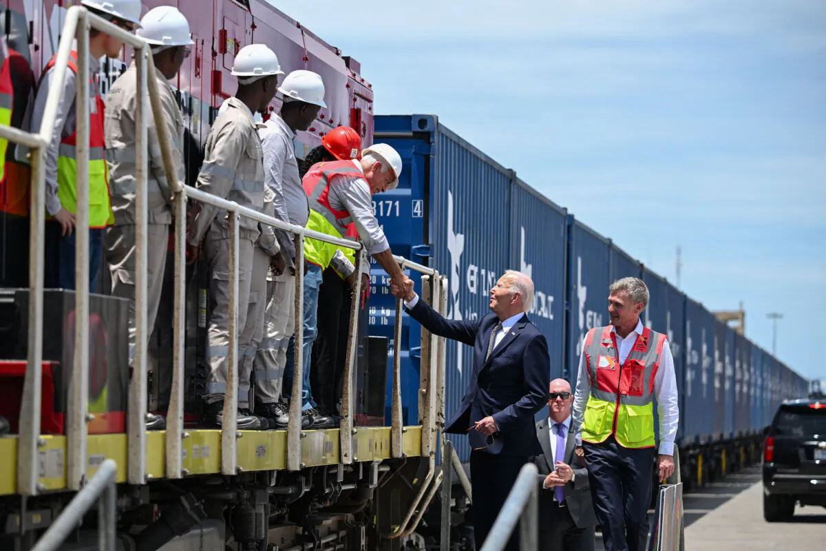 U.S. President Joe Biden (3rd R) meets employees of Lobito Atlantic Railway (LAR) at the Port in Lobito on Dec. 4, 2024. (Andrew Caballero-Reynolds/AFP via Getty Images)