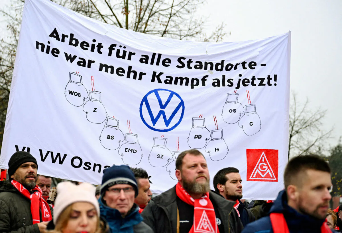 Employees of Volkswagen AG march for higher wages during a "warning strike" of Germany's IG Metall metalworkers' union, in Osnabrueck, Germany, on Nov. 6, 2024. Teresa Kroeger/Reuters