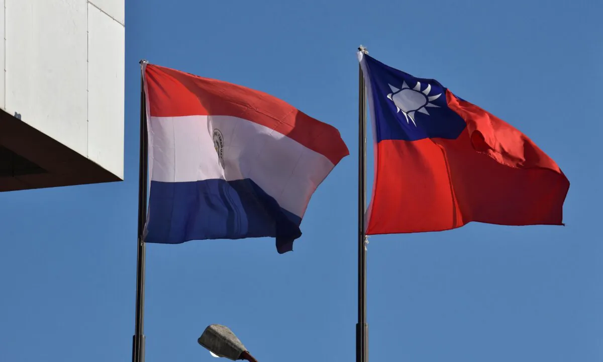 The national flags of Paraguay (L) and Taiwan wave outside the Taiwanese embassy in Asuncion on April 26, 2023. (Norberto Duarte/ AFP via Getty Images)
