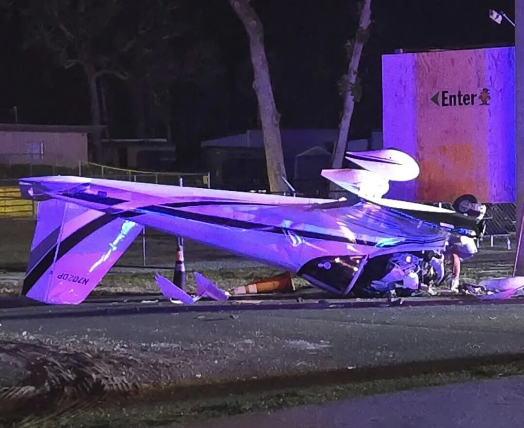 A single engine fixed-wing airplane lies upside down after it crashed on West White Dogwood Drive near the intersection of US-98 in Homosassa, Fla., on Dec. 6, 2024. (Florida Department of Highway Safety and Motor Vehicles via AP)