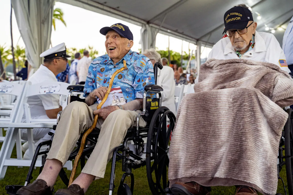 Pearl Harbor survivors, Ken Stevens (L), 102, of Powers, Ore., and Ira "Ike" Schab, 104, of Beaverton, Ore., wait for the start of the 83rd Pearl Harbor Remembrance Day ceremony in Honolulu on Dec. 7, 2024. (Mengshin Lin/AP Photo)