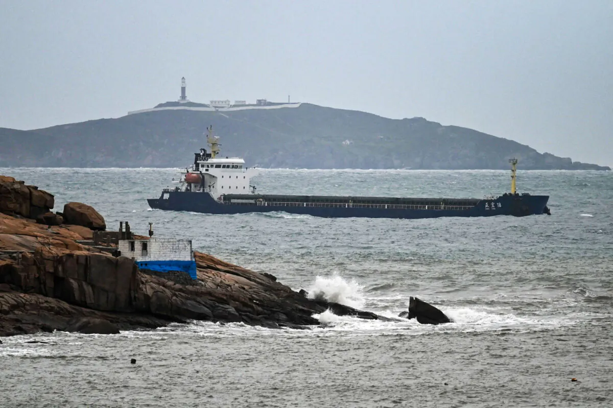A ship sails in the Taiwan Strait between the coast of Pingtan island (foreground), the closest point to Taiwan, and another island in China's southeast Fujian province on April 7, 2023. (Greg Baker/AFP via Getty Images)