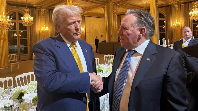 Quebec Premier Legault posted a photo on social media, as shown in this image, of himself shaking hands with U.S. resident-elect Donald Trump during his visit to the French capital for the reopening of Notre Dame Cathedral. (The Canadian Press/HO-Premier's Office) 