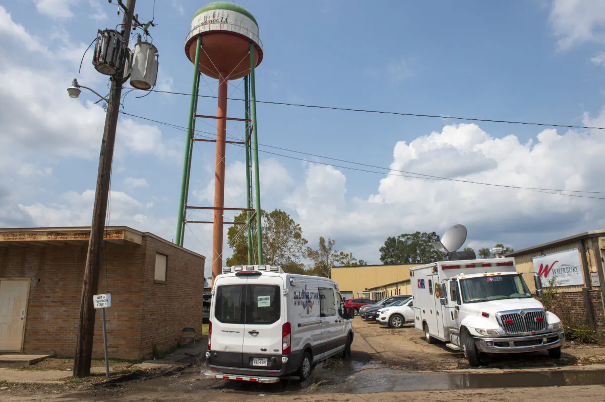 Emergency personnel arrive to evacuate people at a mass shelter,  in Independence, La., on Sept. 2, 2021. (Chris Granger/The New Orleans Advocate via AP, File)