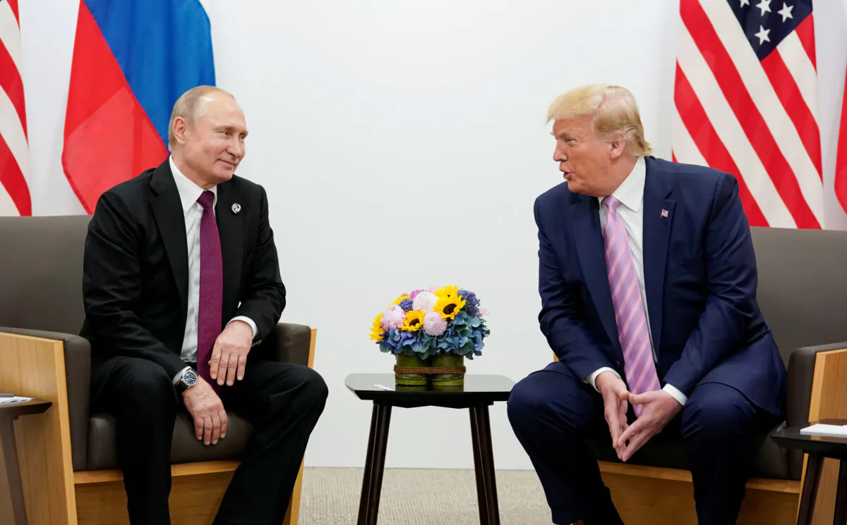 Russian President Vladimir Putin and U.S. President Donald Trump (R) talk during a bilateral meeting at the G20 leaders summit in Osaka, Japan, on June 28, 2019. (Kevin Lamarque/Reuters)