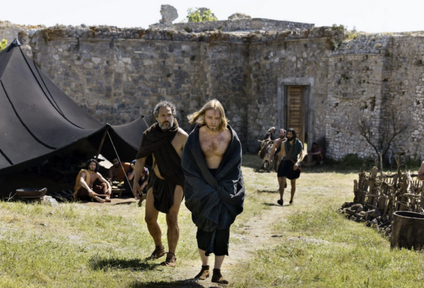 men walking in front of castle in The Return