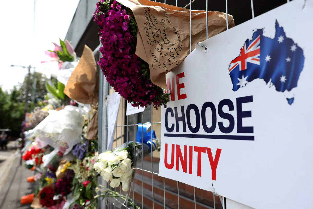 Messages and flowers are seen attached to the fence at the Adass Israel Synagogue in the Melbourne suburb of Ripponlea in Australia on Dec. 9, 2024. (Martin Keep/AFP via Getty Images)