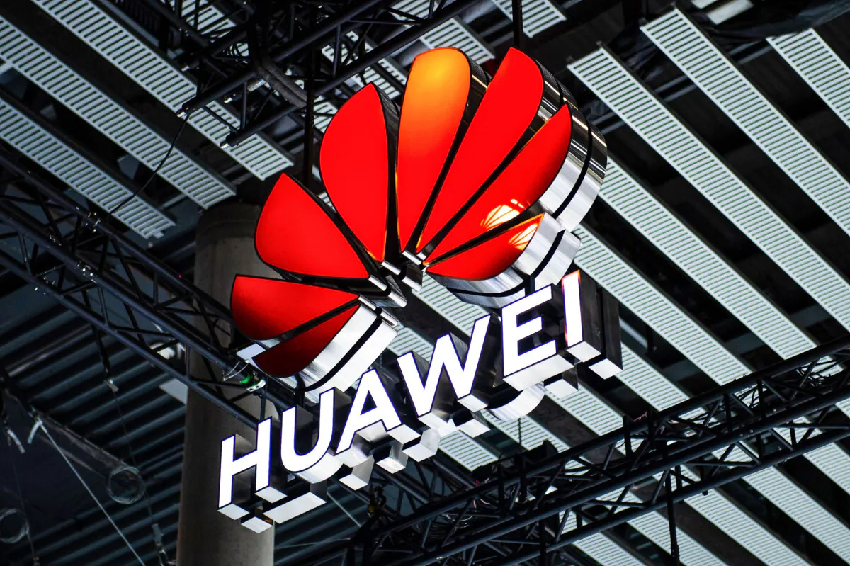 A logo sits illuminated outside the Huawei booth at the SK telecom booth on day one of the GSMA Mobile World Congress in Barcelona, Spain, on Feb. 28, 2022. (David Ramos/Getty Images)