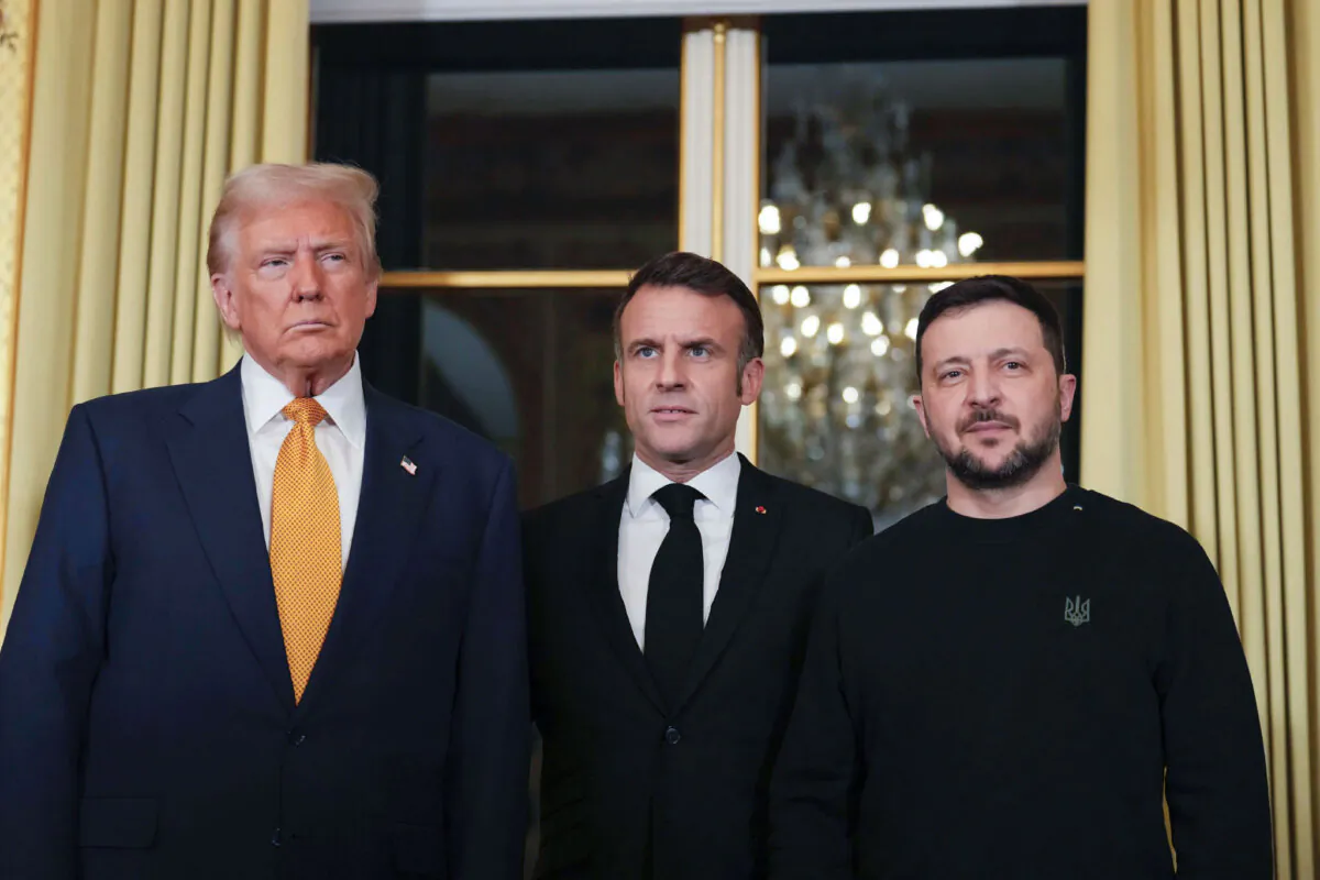 French President Emmanuel Macron (C) poses with President-elect Donald Trump (L) and Ukrainian President Volodymyr Zelenskyy (R) at the Elysee Palace in Paris on Dec. 7, 2024. (Aurelien Morissard/AP Photo)