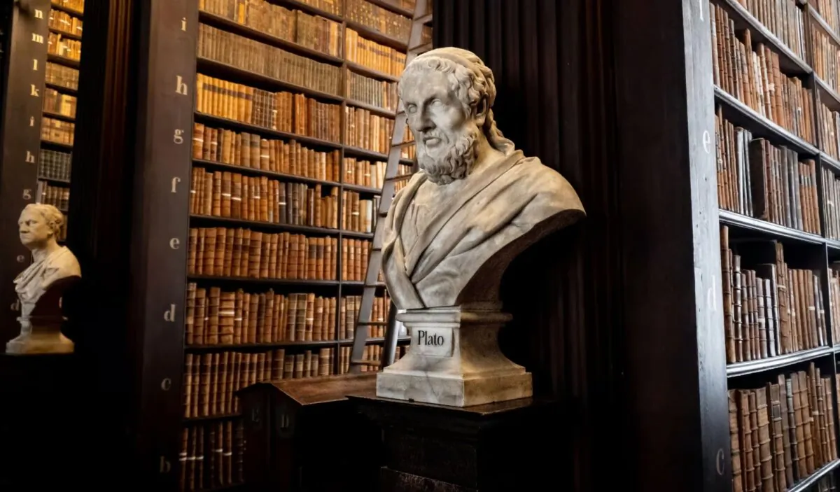 The marble bust of Plato by Peter Scheemakers among an enormous collection of old books in the Long Room at Trinity College’s Old Library legal deposit or copyright library, in Dublin on Oct. 1, 2023. (EWY Media/Shutterstock)