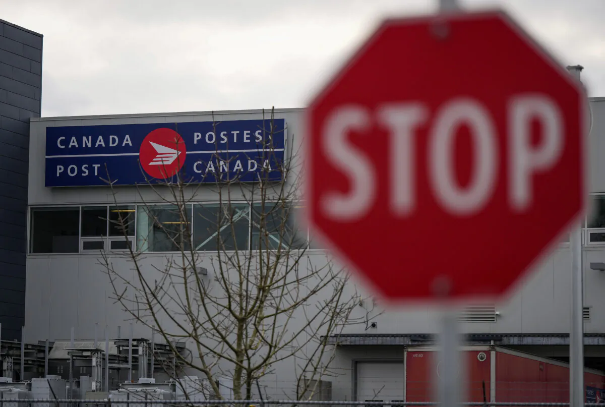 A Canada Post logo is seen on the outside of the Pacific Processing Centre in Richmond, B.C. on Nov. 27, 2024. (The Canadian Press/Darryl Dyck) 