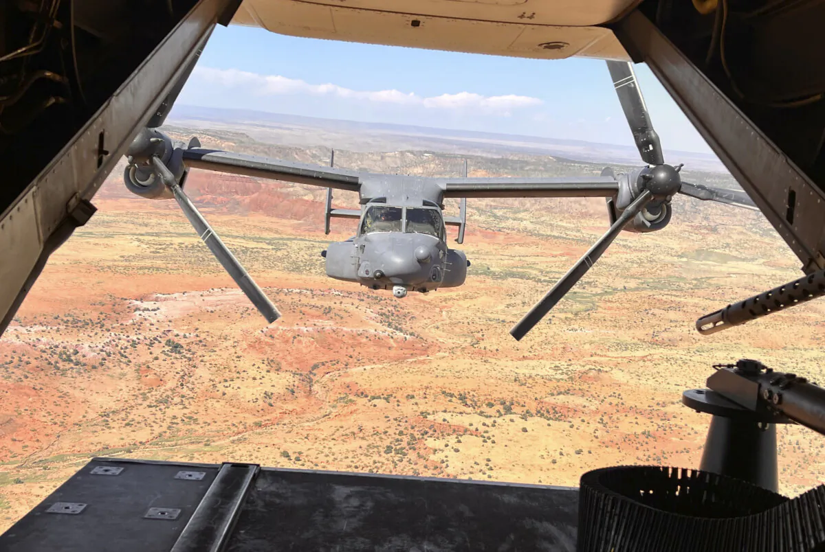 Two Air Force Special Operations Command CV-22B Ospreys fly low and fast in formation on a training range named the Hornet at Cannon Air Force Base, N.M., on Oct. 9, 2024. (Tara Copp/AP Photo)