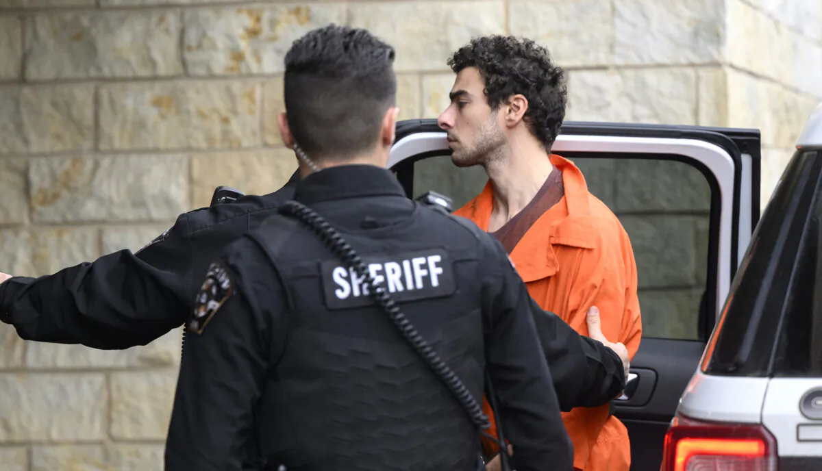 Suspected shooter Luigi Mangione is led into the Blair County Courthouse for an extradition hearing in Hollidaysburg, Pa., on Dec. 10, 2024. (Jeff Swensen/Getty Images)