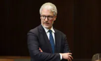 MPs Probe NATO Suspect’s Screening as Privacy Commissioner Says Past Fraud Finding Could’ve Been Shared