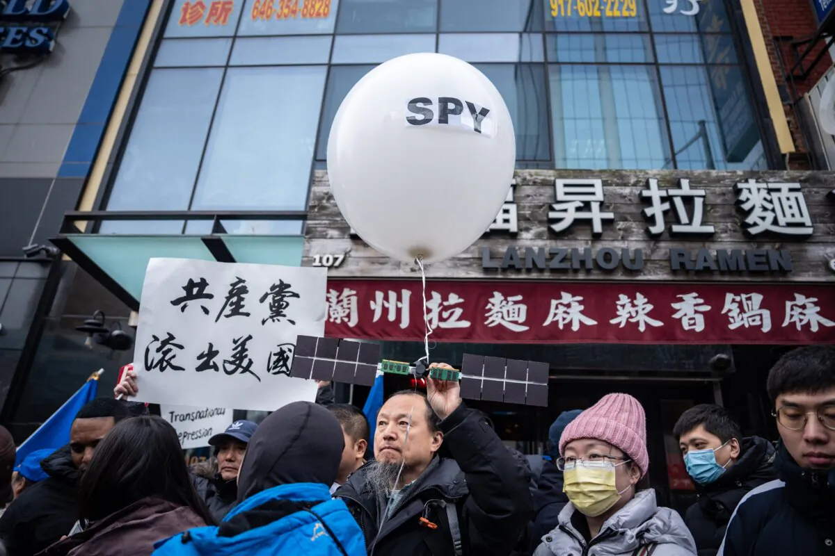 People at a press conference and rally in front of the America ChangLe Association, a now-closed secret Chinese police station,  highlighting Beijing's transnational repression, in New York City on Feb. 25, 2023. (Samira Bouaou/The Epoch Times)