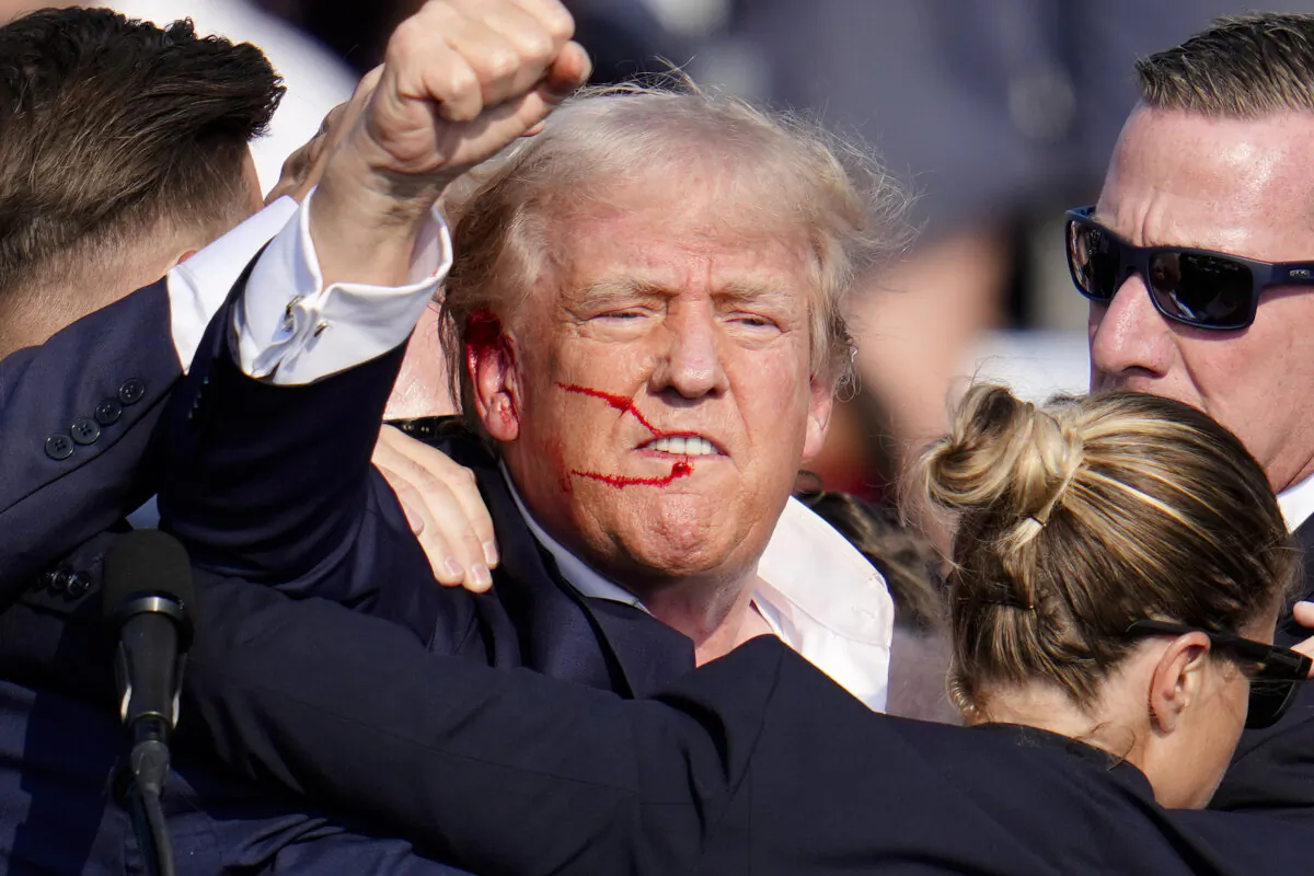 The Republican presidential candidate, former President Donald Trump, reacts following an assassination attempt at a campaign event in Butler, Pa., July 13, 2024. (AP Photo/Gene J. Puskar, File)