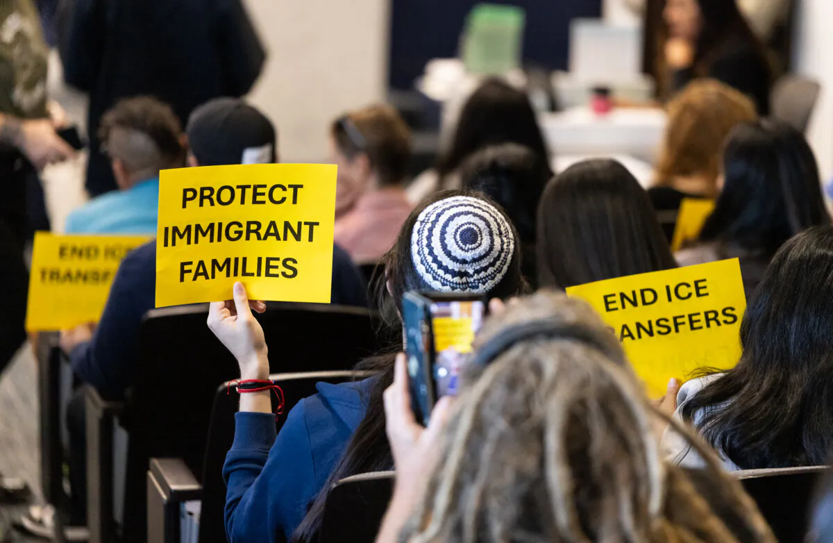 Sanctuary city supporters attend a San Diego Board of Supervisors meeting in San Diego on Dec. 10, 2024. (John Fredricks/The Epoch Times)