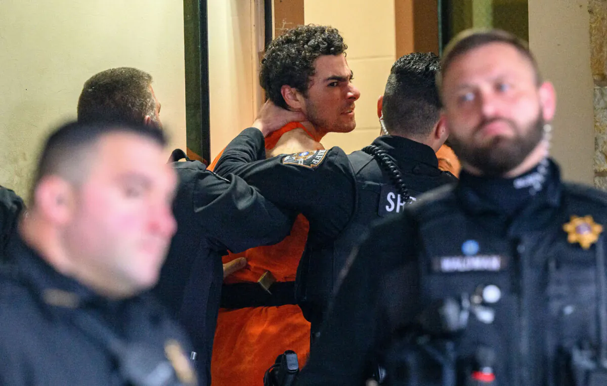 Suspected shooter Luigi Mangione is led into the Blair County Courthouse for an extradition hearing in Hollidaysburg, Pa., on Dec. 10, 2024. (Jeff Swensen/Getty Images)