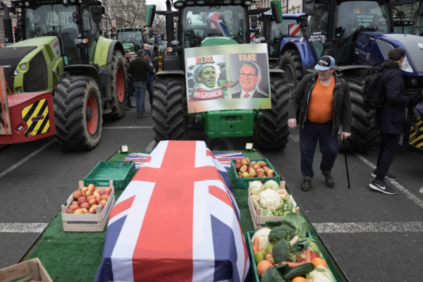 A coffin draped in the Union flag symbolising the death of British farming during a protest by farmers in Westminster over the changes to inheritance tax rules in London, England, on Dec. 11, 2024. (Stefan Rousseau/PA Wire)