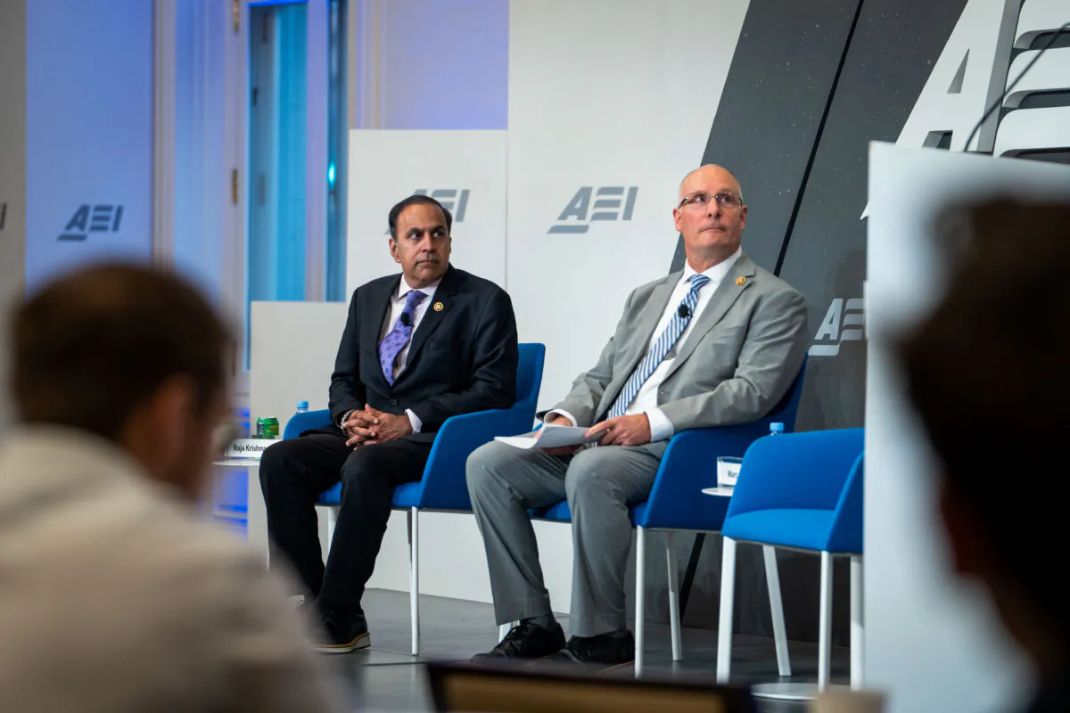 Rep. Raja Krishnamoorthi (D-Ill.) (L), ranking member of the House Select Committee on the Chinese Communist Party, and Rep. John Moolenaar (R-Mich.), the committee chairman, speak at the American Enterprise Institute in Washington on Sept. 25, 2024. (Madalina Vasiliu/The Epoch Times)