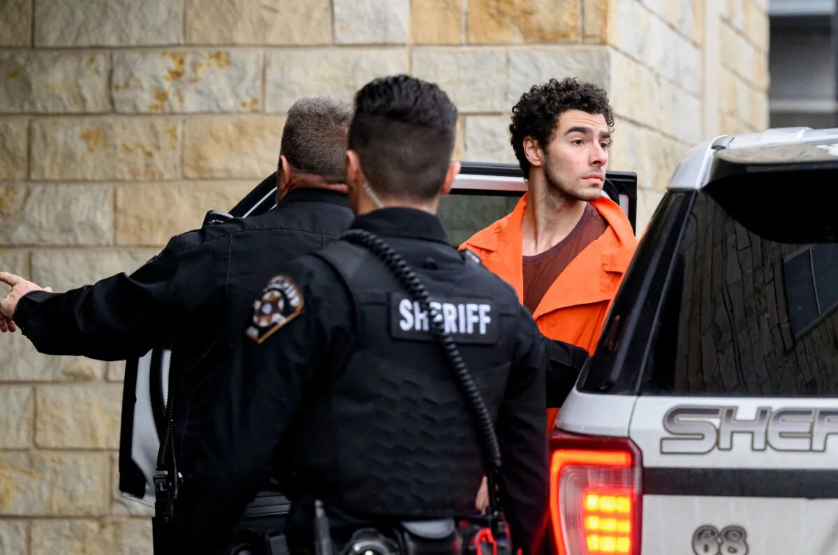 Luigi Mangione is led into the Blair County Courthouse for an extradition hearing in Hollidaysburg, Pa., on Dec. 10, 2024. (Jeff Swensen/Getty Images)