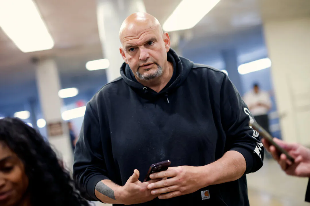 Sen. John Fetterman (D-Pa.) walks to the Senate chamber at the Capitol on April 23, 2024. (Kevin Dietsch/Getty Images)