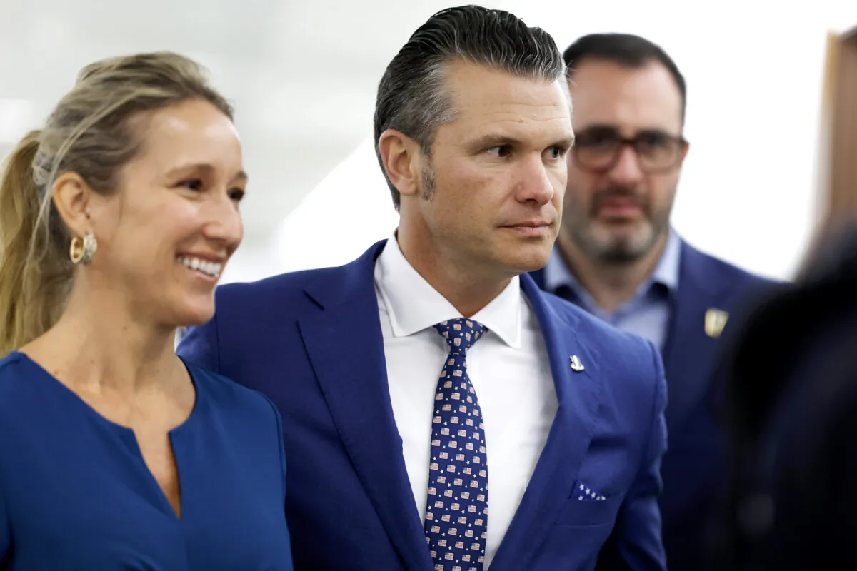 President-elect Donald Trump's nominee to be Secretary of Defense Pete Hegseth and his wife Jennifer Rauchet (L) walk through the Hart Senate Office building in Washington on Dec. 11, 2024. (Anna Moneymaker/Getty Images)